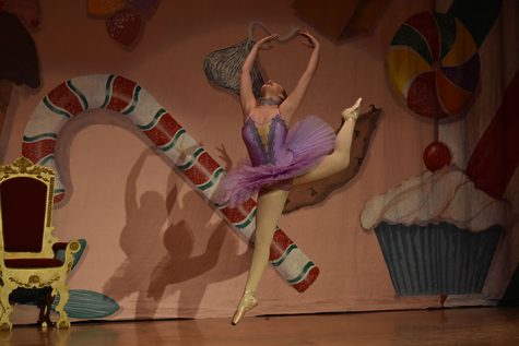 LEAP — During the final dress rehearsal before the performances, sophomore Rachael Lenker does a Firebird as part of her role as the sugar plum fairy in The Nutcracker. “The role of the sugar plum fairy was a great honor. I was very excited and grateful for the opportunity,” Lenker said. “The hardest part about preparing for the show wasn’t only remembering the choreography, but performing with proper technique and entertaining stage presence. I love every part of the show, but if I had to pick a favorite part, it would be the ending scene when everyone comes out to bow. That moment is so magical and is what I look forward to every show.”