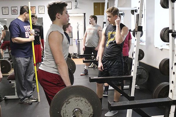  The JV and varsity football teams work out in the weight room. They have been doing this since the season ended. “It’s not that I enjoy lifting, I do it to push myself and to make my brothers better,” sophomore Bryce Dragna said.
