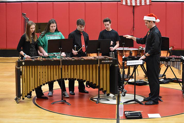 PERFORM – Performing in front of John S. Clarke Elementary students and faculty, the Percussion Ensemble plays. The Percussion Ensemble performs every year during the Pride Program. “My favorite song was Jingle Bells because it gets me excited for Christmas,” Trae Sadowski, fourth grader said. 
