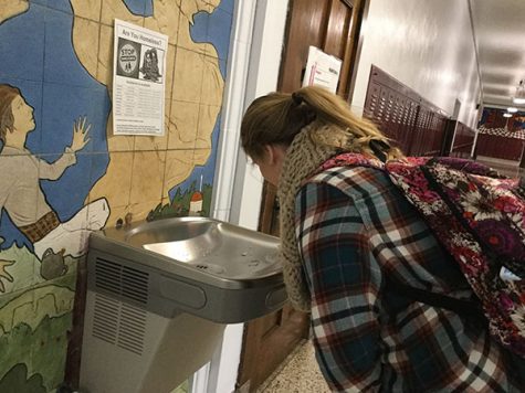 While bending down to the water fountain on the third floor, junior Hannah Duncan drinks out of the fountain. Students are not allowed have water bottles on them, so they must drink out of the fountain. “I don't like drinking out of the water fountains because they are dirty and people put their mouths on them.” junior Hannah Duncan said. “The water does not taste bad, but I would just rather bring a water bottle in my bookbag.”