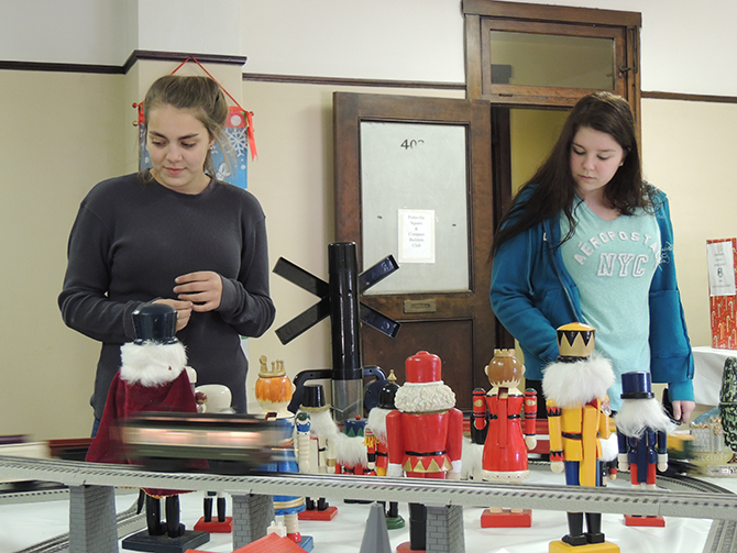 Juniors Stephany Trate and Paige Zerbey observe a set of nutcrackers that were set up for the Christmas Gala. This was Trate’s second time attending and Zerbey’s first time at the gala. “It was really cool. I liked seeing all the trees and decorations. I will definitely be coming back again next year,” Trate said.
