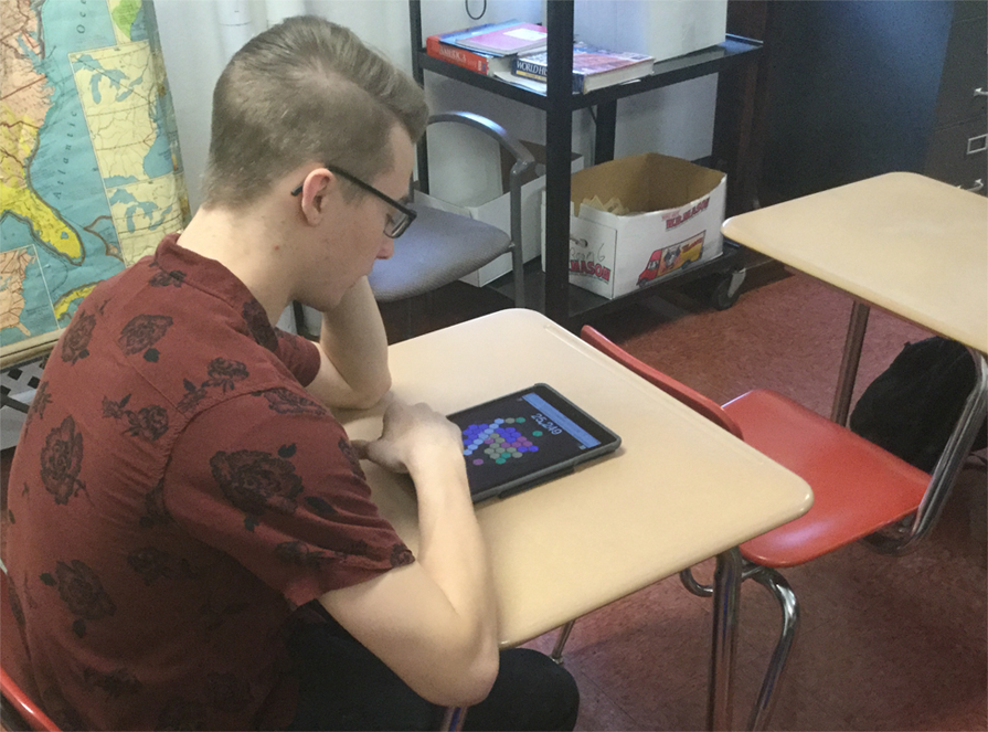Senior Jacob Horning plays Hex.frvr during homeroom between the morning announcements and the bell for first period classes. 
