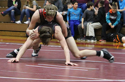 Senior Ryan Green works on winning his 120-pound bout during the January 17 match against Lehighton. The team won the match 58-18. “The level of technique and intensity of the kids we wrestle prepare us for any wrestler we can face in the league, and all of these matches, including after leagues, prepare us for districts as well,” Green said.