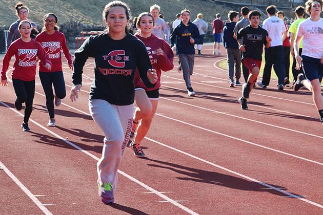 Junior Erin Cleary runs around the track during the first week of practices. The track team got only five practices in before storm Stella hit. “My goal for this year is to make it to districts. “I work hard at practice every day and try to get my height up for pole vault,” Cleary said. 
