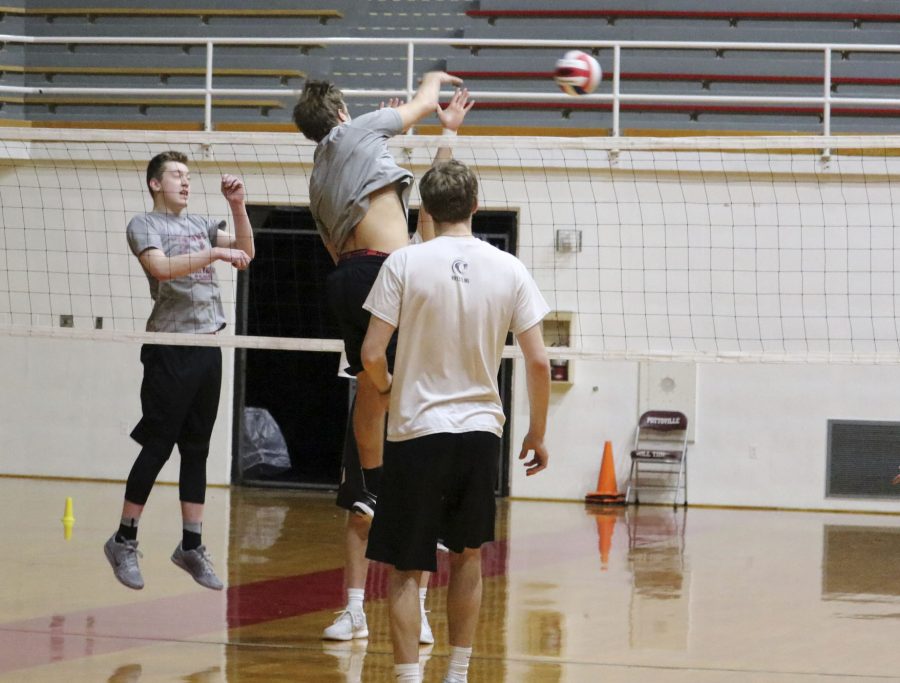 Junior Ian Renninger spikes the ball at practice. The team played its first match March 30. “My favorite part is going up to spike the ball,” Renninger said.