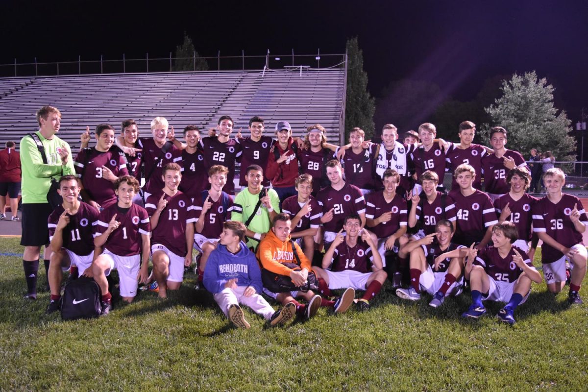 The soccer team takes a team photo after winning against Blue Mountain on September 20th.