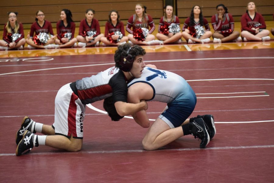 On the wrestling mat, junior Nick Onea looks to turn his opponent. Onea and the Crimson Tide defeated Blue Mountain on senior night by a score of 34-32. “I knew I just had to stay on my offense and wrestle smart,” Onea said.
