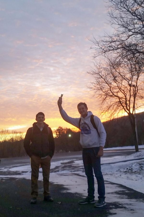 Swimmers at Sunrise
Freshman Zaidian Van Orden and junior Zachary Turnitza pose for a picture at sunrise after a 6 a.m. practice. The swimmers spent the morning lifting weights, doing body exercises and swimming laps at the Ned Hampford Natatorium. “It’s a pain to get up at 5 a.m. and then swim at 6 a.m., but it’s very beneficial and I’m glad we have them” Van Orden said.