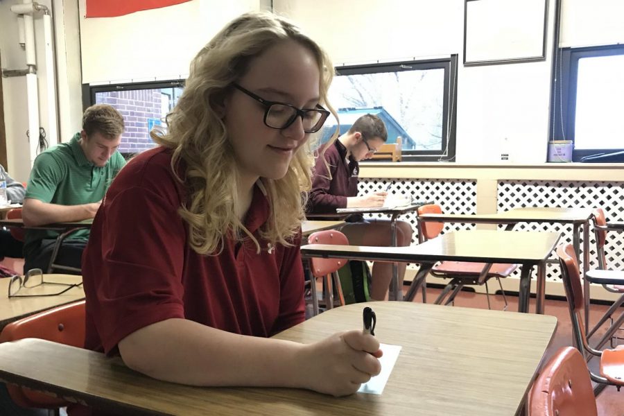 THINK - While sitting in homeroom, senior Abby Wiederhold fills out a slip that instructed her to explain her favorite part of PAHS. The slips were distributed to each homeroom for students to fill out and were then hung up outside of Room 223 to showcase all the good students see in the school. “I felt like this was a great initiative to promote positivity in our school,” Wiederhold said. “Lately, there have been a lot of things that schools are trying to do in order to get students to be more comfortable and happy in their academic environments, so I thought this was a step in the right direction.”