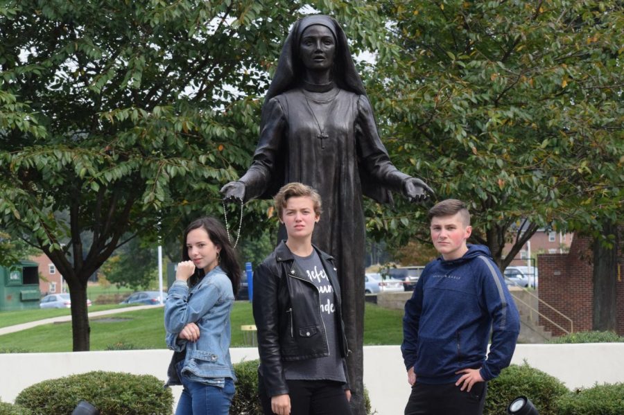 In front of a statue of Jane Frances de Chantal, sophomores Lily McDonald, Kendra Speak, and Jake Montgomery pose for the camera. The Drama Club, Stage Crew, and Dramatic Literature class went on a field trip to DeSales University to watch a Shakespeare play. “It was nice to see profesional actors so we can learn from them and do better. The show was good and fresh,” Autumn McDonough, senior said.
