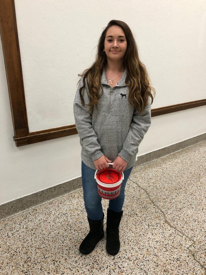 Gwen Hamilton, freshman, collects money for Penny-a-Week. Student Council has been using these donations to buy presents for children for years. Every child deserves to wake up with a smile, John Hanaway said.