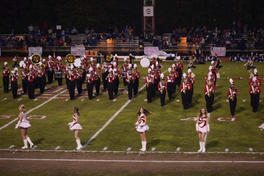 Members of the band and band front are putting on their pregame show before a football game/ The performance ended in the band spelling out TIDE and playing the tune March Grandioso. Sophomore Emma Smith said I always had so much fun being around the entire band during marching season.
