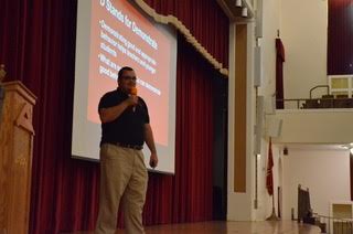 Mr. Lucas Bricker is sharing a slideshow presentation for the PBIS Assembly. He explained the importance of PBIS and PRIDE. "Mr. Bricker made the assembly fun and very enjoyable for the audience," said Camron Williams [student in the audience]. 