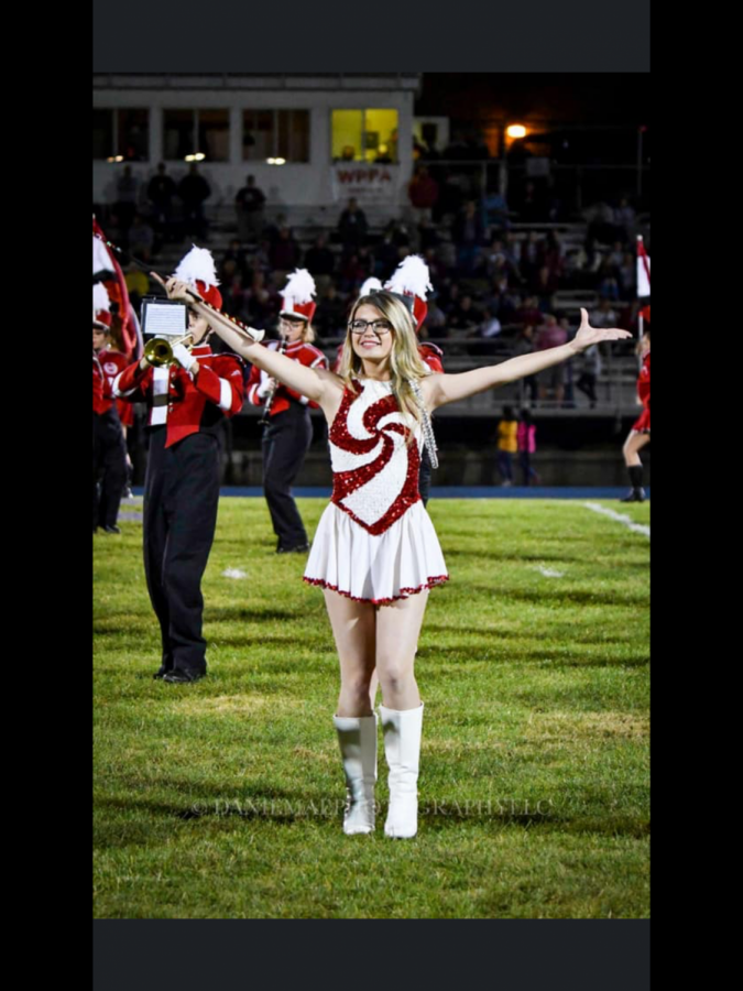 Allie Murton, Co-Captain of the majorette squad twirls her baton at the Pottsville vs Tamaqua game. “ It has been a stressful year but I enjoy being able to decide which uniform we should wear and what I want to do routine wise. I’ll miss being with my girls and messing around during the games and having fun with everyone.” 
