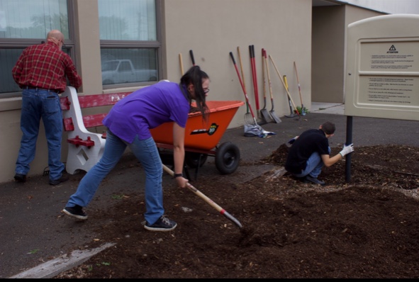 Sophomore Victoria Lutz moves mulch to a planter bed at John S. Clarke elementary center on September 16, 2019. Lutz, a student in the PAHS Life Skills class, had the opportunity to learn landscaping skills with her peers while helping beautify the school grounds. “I loved learning how to landscape because it’s different from everyday school activities.”