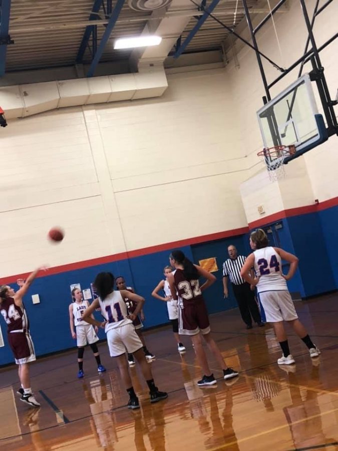 7th grader Lainey Dusel shoots a foul shot during an away game.