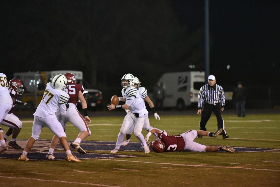 Junior Robert Walchak dives in an attempt to tackle the ACC quarterback. Walchak played football since he was young and has dreamed about winning the District Championship. “We deserved that win so much more than any other team in the district,” said Walchak.
