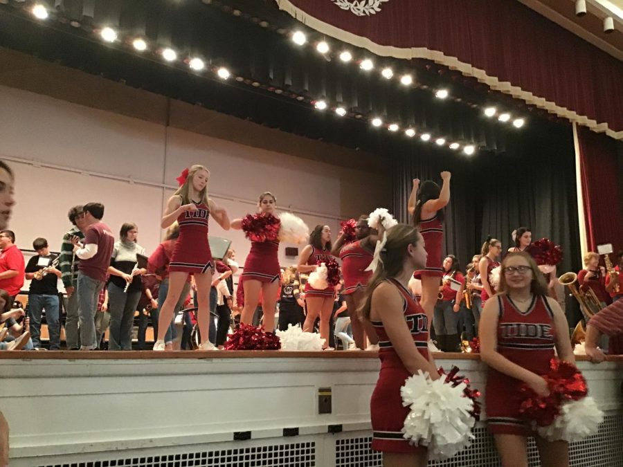 Cheerleaders get ready to perform for the pep rally on stage in the auditorium. Tiana Green said, “ My favorite cheer we perform is of course everyone’s favorite ‘Give a Yell’. Everyone goes crazy and it’s the best cheer around in my opinion”.