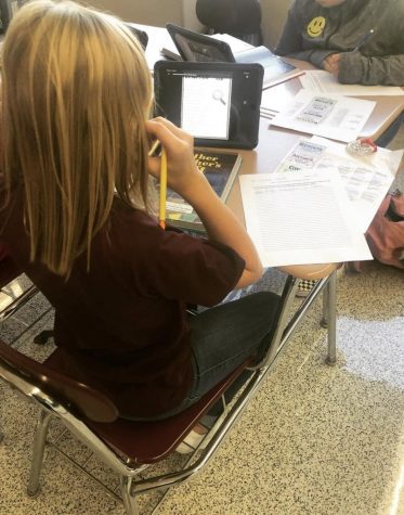 WRITE - Sixth grader Lexie Scanlan uses her iPad to assist in completing a text-dependent analysis assignment in ELA class.