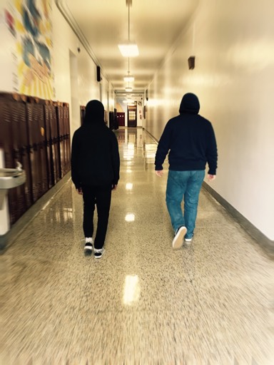 Two students walk down the hallway at PAHS while wearing their hoodies with their hoods up. The Pottsville Area School District has had a strict ‘no hoodie policy’ since May 13 of 2009, and now has taken a next step to confiscate any hoodies worn during the school day. “I’m not a big fan of the hoodie policy, but if a teacher would say to take it off, I do. But if it’s very cold, I usually go through the day with the hoodie,” sophomore Justice Lewis said.