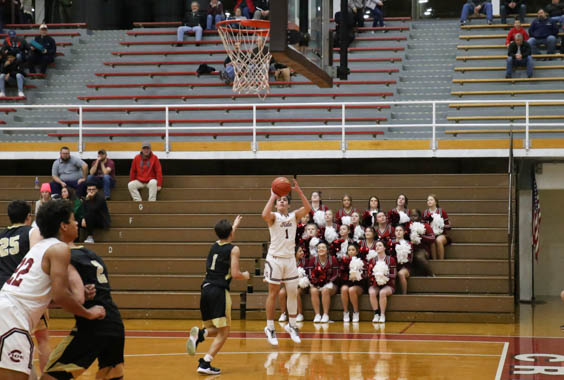 Junior Nicco Heimbaugh prepares to shoot the ball into the hoop. Heimbaugh has been play basketball for 10 years. “Basketball has always been my favorite sport; I love it,” said Heimbaugh. 