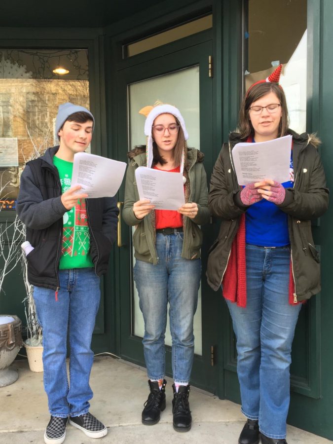 Junior Jake Montgomery, sophomore Alyssa Sheriff and Junior Julia Malek sing Christmas carols in front of the Majestic Theatre in downtown Pottsville. The PAHS Crimson Players spent time singing for small business Saturday on Saturday November 30. 