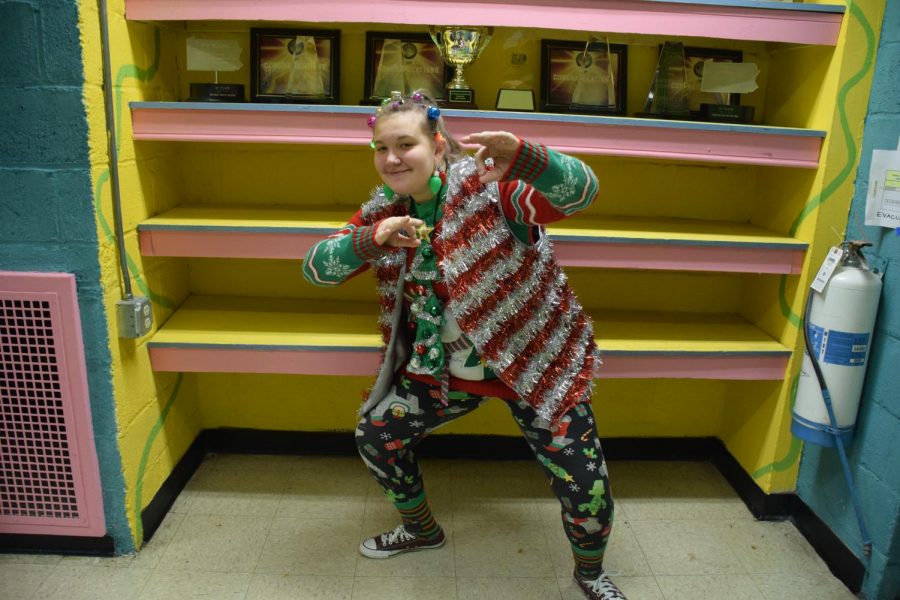 Junior Laura Hunt shows off her holiday ugly sweater ensemble. Many students who entered the contest coordinated entire outfits to complete their looks. Hunt said, “Im a very festive person during the holidays, so I use this as an opportunity to show my spirit!”