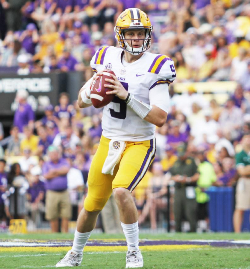 Louisiana State University quarterback Joe Burrow  stands with the ball hoping to make a play. LSU beat the Clemson Tigers with a comeback win of 42-25. 