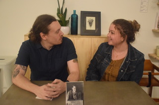 Barista Timothy Mengle explains the hardships of writing his second poetry novel to freshman Samantha Woodford. Mengle talked about his experiences with his success in the small town of Pottsville.
