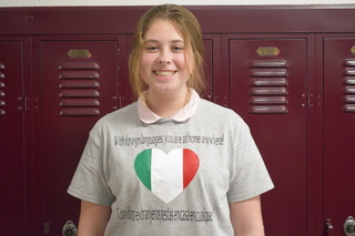 Sophomore Kaylee Becker wears her Spanish t-shirt on Thursday March 5, 2020. Students in Ms. Lloren Reichert's Spanish classes were given the chance to wear Spanish shirts for bonus points. While some students customized their t-shirts, others simply attached a flag. "I printed out a Spanish flag for Foreign Language Week but it got crumbled, so I printed out a smaller one to attach to my shirt," said junior Naomi Brode.