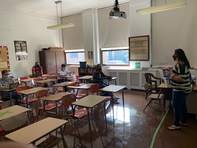 Students sit inside Mrs. Watt’s classroom socially distanced during class. A lot of schools had to adjust to a hybrid plan because of socially distancing guidelines. Sophomore Kenzie Androshick (not pictured) said, “It overall just limited the things I could and couldn’t do. 2020 was not the year we expected.”