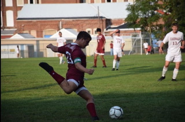 Senior Dylan Bohorad kicks the ball down the field. The Tide took the loss to The Cardinals 1-0. Dylan Bohorad said, “The best thing I like about Zach is his determination for the game. He loves soccer and loves to coach.”
