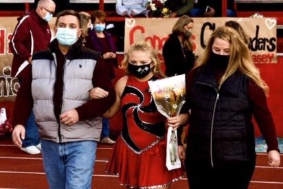 Senior Kaleigh Sibbett is escorted down the track with her parents during senior night. Senior Night was held on Friday, October 2nd to honor the 2021 seniors for band, band front, and the football players. “It is still so hard to believe that I am a senior and was able to walk down the field with my parents, said senior Kaleigh Sibbett.