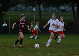 Lexy Maccarone dribbles down the field finding a player to pass to during the game against North Schuylkill. Pottsville Girls Soccer took home the win against North Schuylkill with a score of 6-0. Lexy Maccarone said, “In order for us to win the championships against Minersville I think we just need to play our game by passing, moving, and making smart decisions.”