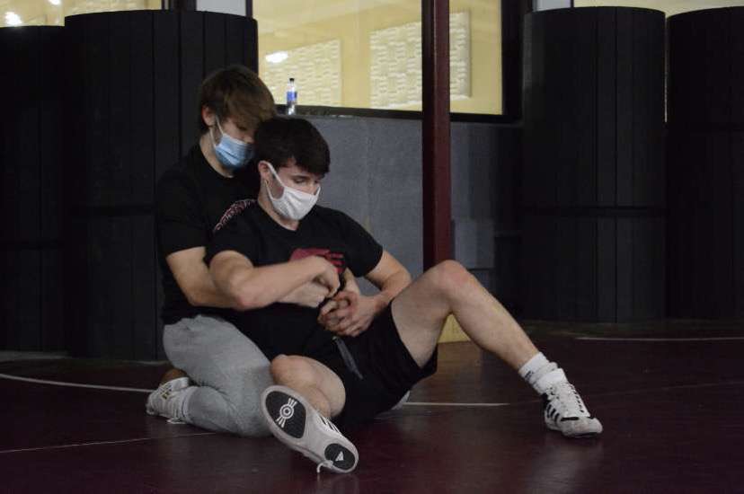 Nativity Senior, Matt Ross is in action at wrestling practice getting ready for the season. The wrestlers had to adapt to wearing masks during practice. Ross said, “Most of us have things we can do to stay ready for the season at our houses so it won’t affect us too much.” 