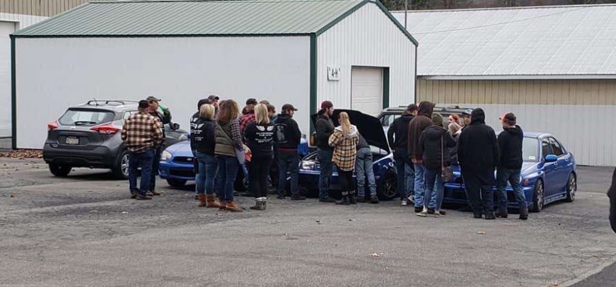 Family and friends gather around Mike’s car (middle) surrounded by the other two cars that belong to his best friends. Cars were something Mike was very passionate about. Lexi Platchko (not pictured) said, “I thought the event was very nice because it included some of Mike’s favorite things.”