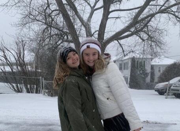 Junior+Emilee+Rose+and+senior+Greta+Snukis+take+a+winter+weather+photo.+On+December+16%2C+2020%2C+students+had+a+day+to+spend+outside+enjoying+the+snow.+Junior+Emilee+Rose+said%2C+%E2%80%9CI+enjoy+snow+days+because+watching+the+snow+fall+is+very+pretty.%E2%80%9D+