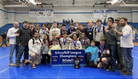 The Wrestling team poses after winning the Schuylkill Championships. The Schuylkill League Championships were held at Blue Mountain this year. “It was satisfying to win the league after training throughout all of high school, it was important to the team as well as my teammates to bring it home,” said senior Mark Ritschel. 