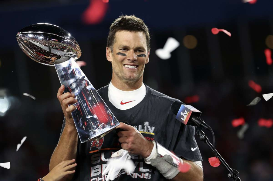 Tom Brady(pictured above)is posing after his last Super Bowl, holding his trophy. He recently announced his retirement from the NFL after being quarterback for 22 seasons. A lot of times, I find that people who are blessed with the most talent dont ever develop that attitude, and the ones who arent blessed in that way are the most competitive and have the biggest heart, Tom Brady.