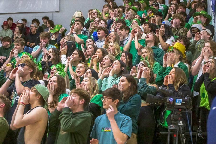 Students in the student section cheer while wearing green for a St Patrick’s Day theme. St Patrick’s Day is more than just green and pots of gold, it is also a holiday known for bringing diversity to Ireland. “I think it was nice that he brought diversity to Ireland,” said senior Lucy Snyder.