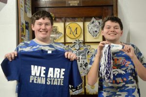 Jacob and Jonathan Barket pose with Penn State merchandise. They both committed to Penn State and hope to get a degree in business. “We feel that it’s like a dream come true. It’s a part of Pennsylvania and a perfect college where there’s an actual community there that shows kindness for each other. We might join a club or sport if we want to in the future,” said seniors Jacob and Jonathan Barket
