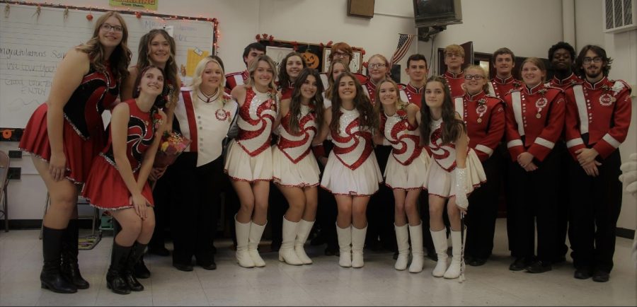 Pictured above, the PAHS Marching Band members stand together before their senior night performance. All of the PAHS seniors involved in band, flags and majorettes got together in the band room to take a picture. 