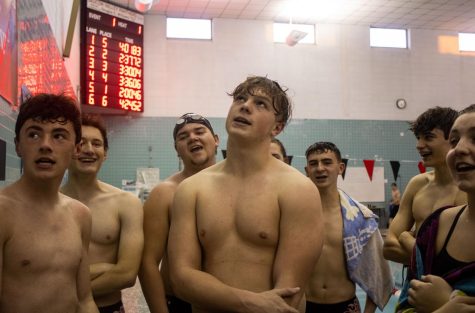 Swimmers stand with each other after the 400 freestyle relay, laughing and talking about their times. “Swim and dive is mostly a mental sport. You could have all your technique down but when it comes to yourself mentally, you could crack at the pressure. That’s why it’s really encouraging to have all your teammates backing you and cheering you on. Even the littlest bit of validation can help,” said freshman, Billy Davis.