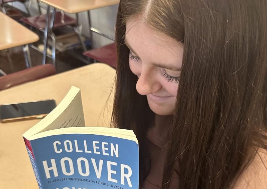 Senior Alyssa Goodman takes a break from school work and opens up her favorite book. Colleen Hoover self published her book November 9 in 2015.