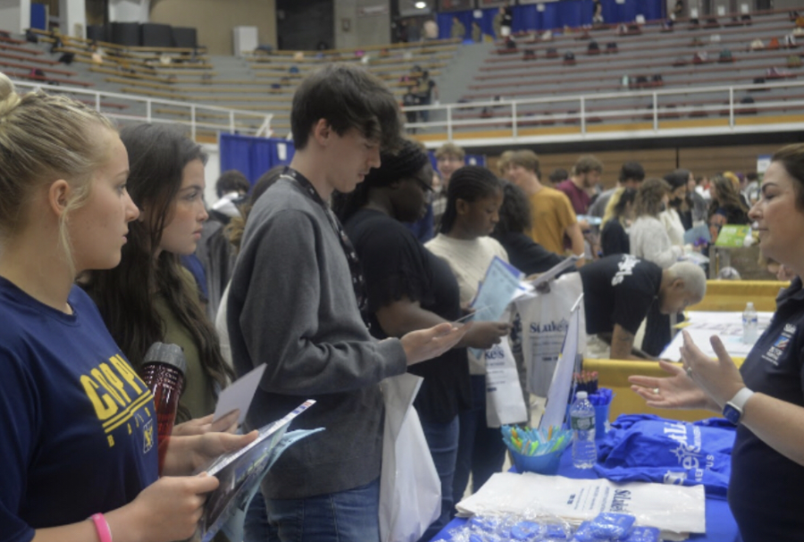 Students from PAHS received information from a local business at the career fair on April 26, 2022. The career fair allows for many students to figure out what they want to do in the future. 