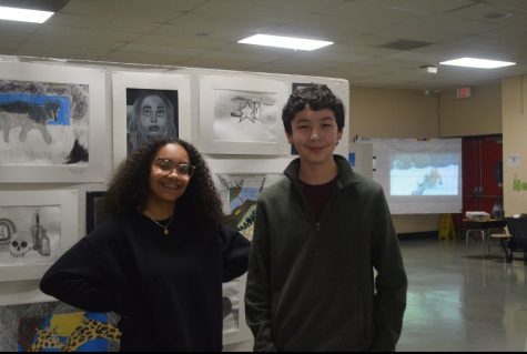 Sophomore Anabellly Valdez and Robert Rulavage pose next to an Art Board featuring student artworks taken last May 13, 2022. The Art Show is an annual event held at John S. Clarke Elementary Center. The event will be held on Friday, May 12, from 6:00pm to 9:00pm.
