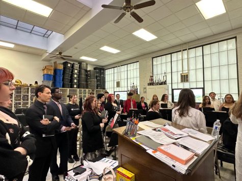 The choir members warm up as they prepare to go on stage for their concert. Senior Xaviere Phillip Johnson said, “I am excited to have my last choir performance but sad I won’t have another concert. My favorite song has to be “Isn’t She Lovely” because you can’t go wrong with Stevie Wonder.”