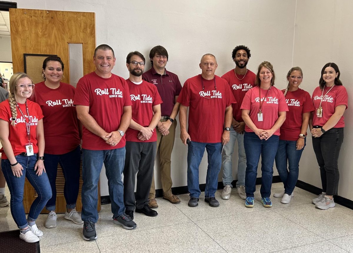 POSE - Pictured are some of Lengels new staff members in their Roll Tide Since 2023 shirts.