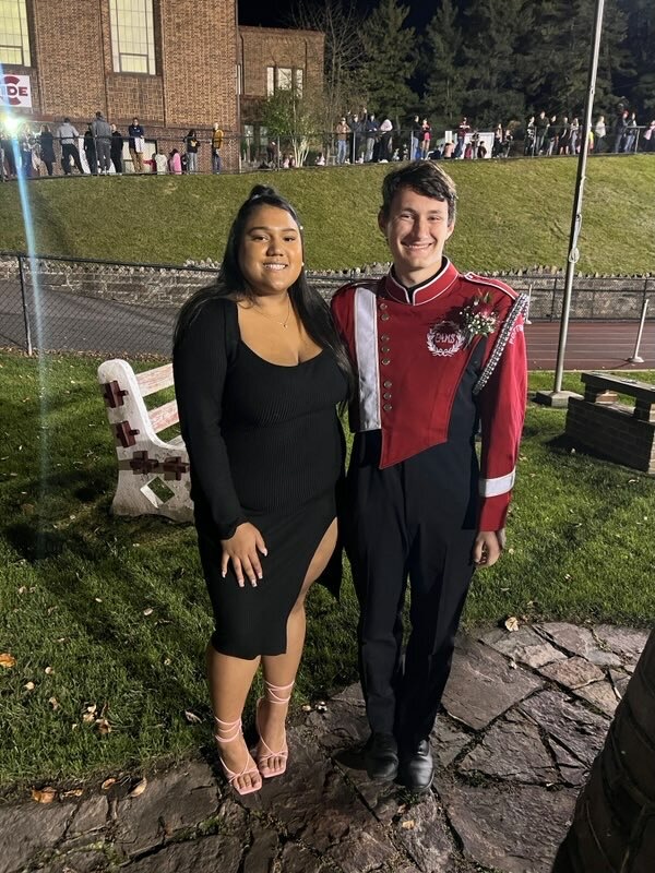 The second runner up for king was Vincent Prestileo and the second runner up for queen was Jacquelyn Carabello-Snowell. The two stand together for a picture during the football game’s halftime. 