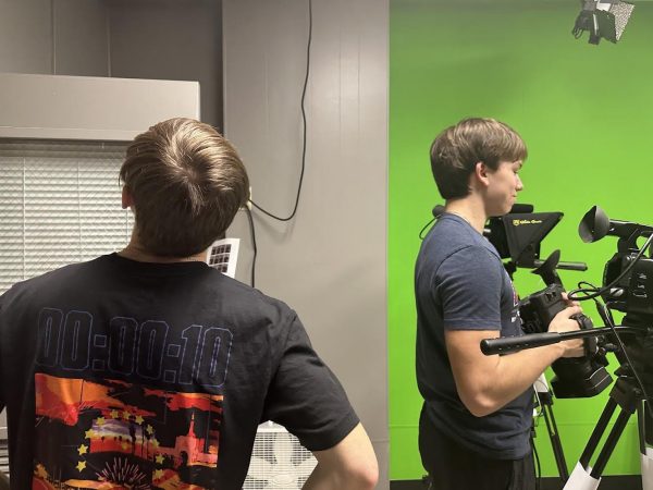 Evan Galavage and Ryan Galen are preparing to make a video for the Tidelines website. “I really enjoy TideTV, I like how it connects with everyone at Pottsville. I am the VTR person who is the one who has all the roll ins, commercials, intros and the outros,” said sophomore Quinn Evans. 
